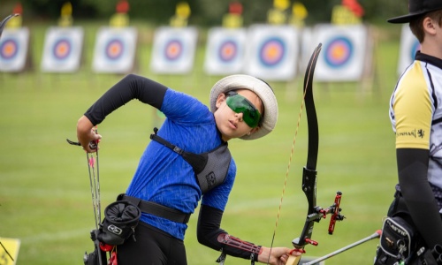 Student Eva at an Archery Competition